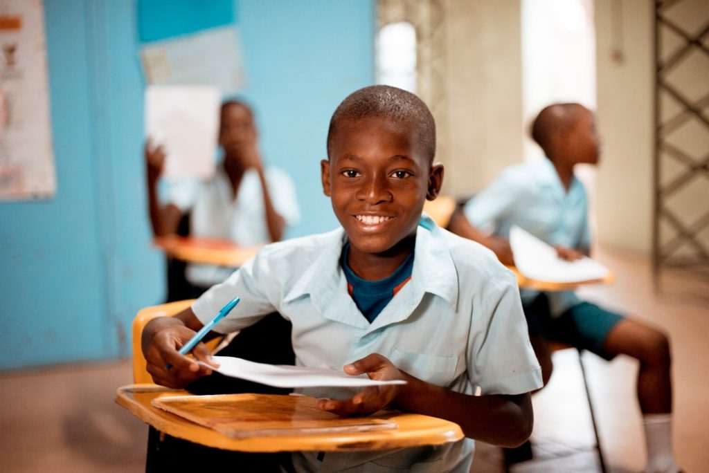boy-holding-white-paper-83tkhlpgg2q Got this shot while on a medical mission trip in Haiti. Love the smile of this boy!